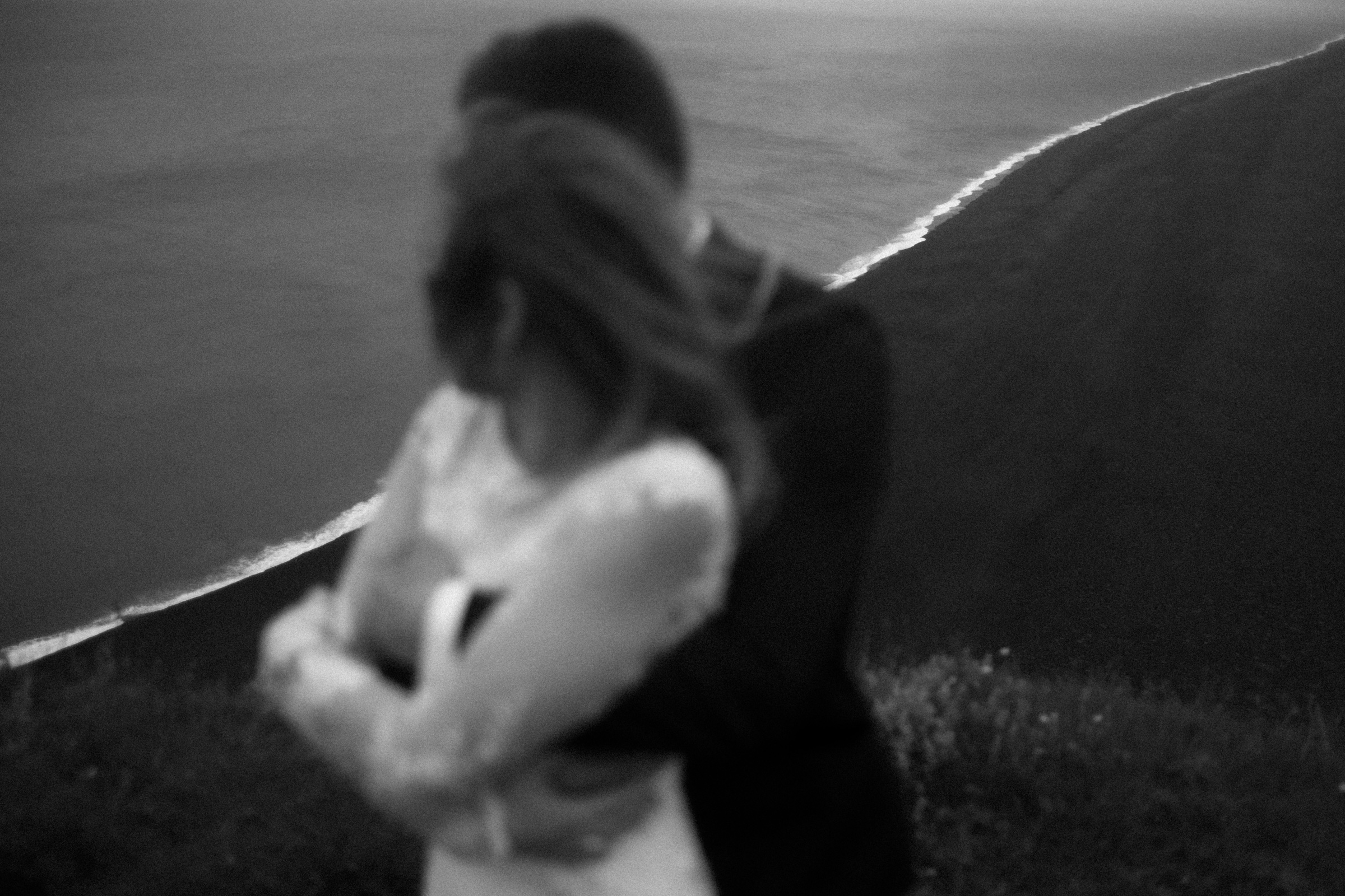 Iceland wedding photographer — couple on dramatic coastal cliffs