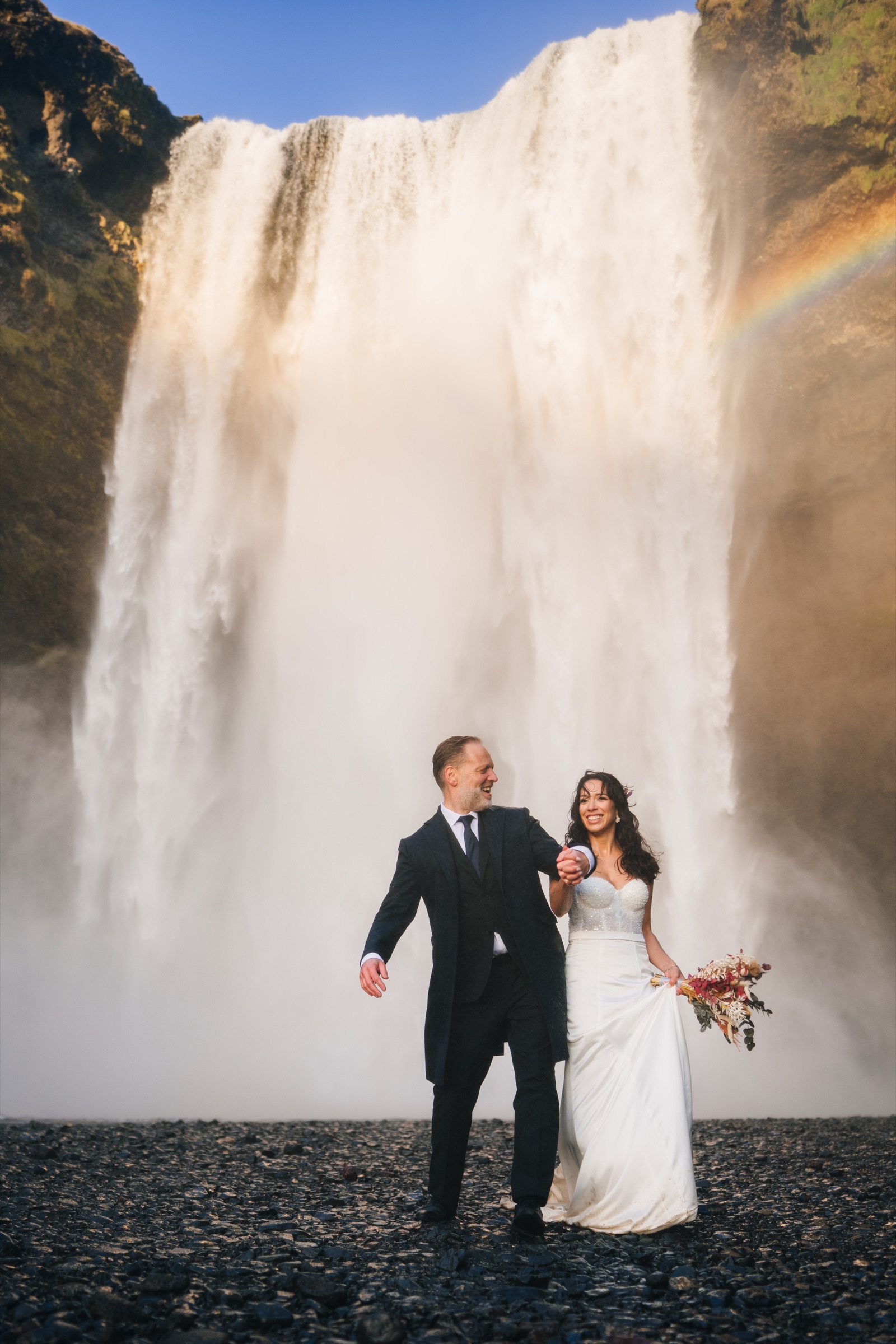 Iceland wedding photographer — couple embracing in dramatic landscape